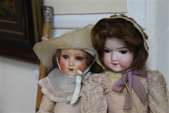 An Armand Marseille bisque headed doll & another doll